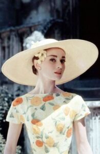 audrey hepburn ivory hat with pale yellow floral dress