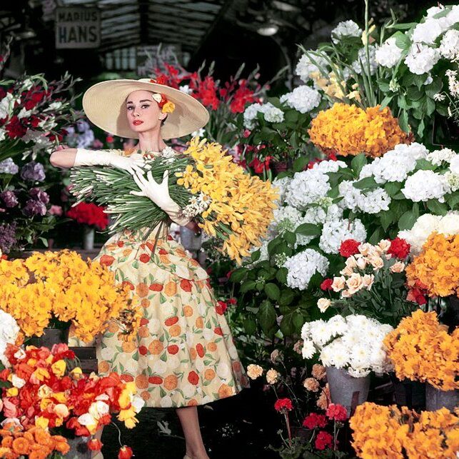 audrey flowers audrey hepburn holding flowers in a market