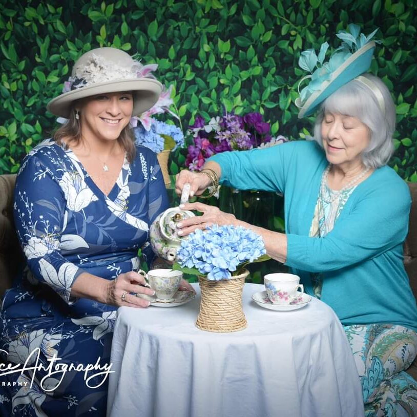 Mother and Daughter having tea in their Polly Singer hats
